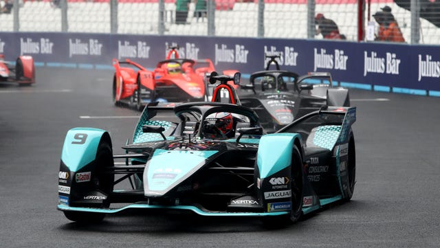 Mitch Evans celebrates a Formula E victory, bolstering his title push