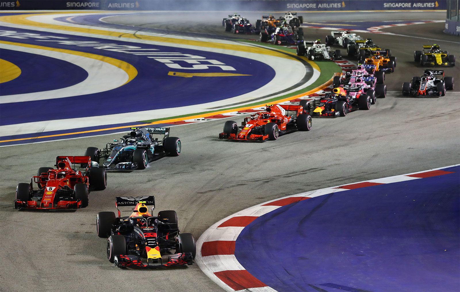 Lewis Hamilton in the garage, emblematic of F1’s relentless performance culture