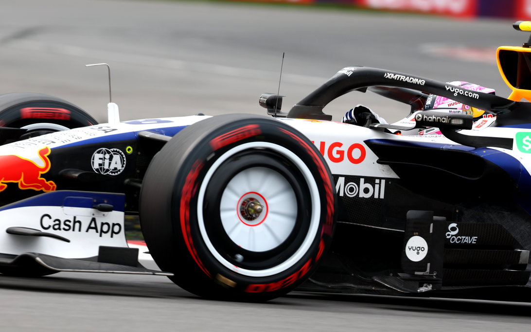 Liam Lawson and Sergio Perez battle during the Canadian GP sprint at Circuit Gilles Villeneuve