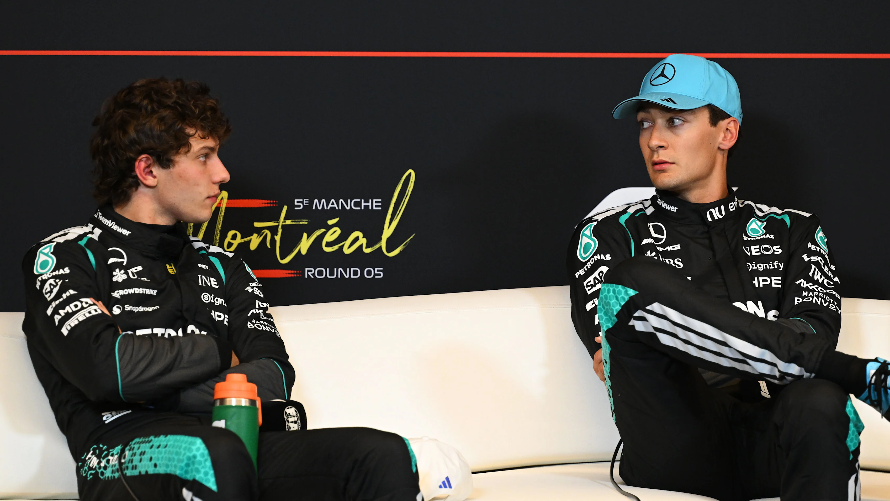 Kimi Antonelli discusses the debrief with George Russell and Toto Wolff