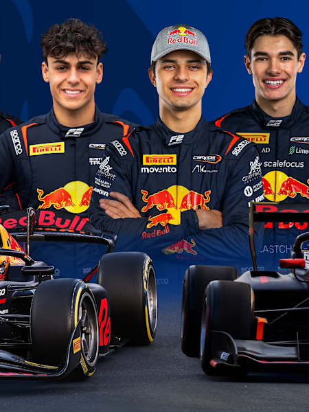 Red Bull Racing staff celebrate a podium result in the garage