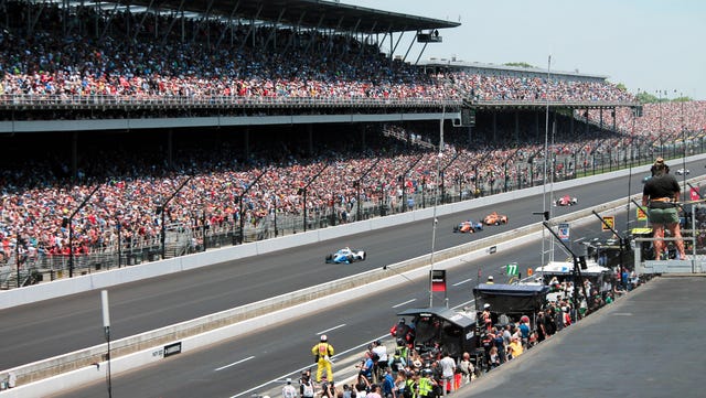 Paddock Buzz: Contenders Thrive in High-Stakes IMS Traffic Battle 2 Indy 500 contenders running in traffic during practice at Indianapolis Motor Speedway