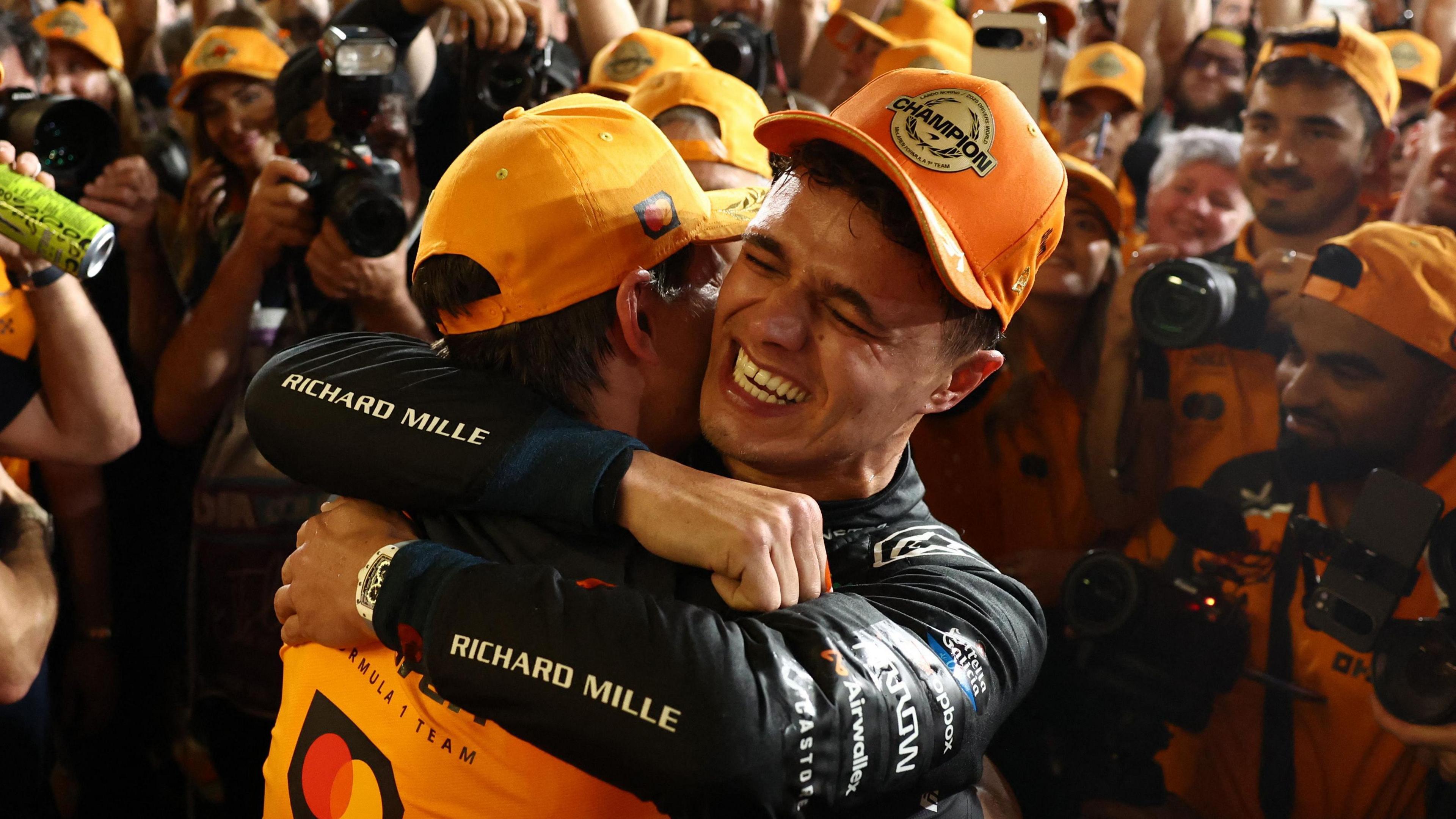 Lando Norris Poised for Victory Celebrations at Legendary Motorsport Event 3 Lando Norris with McLaren MCL60 celebrating F1 world title