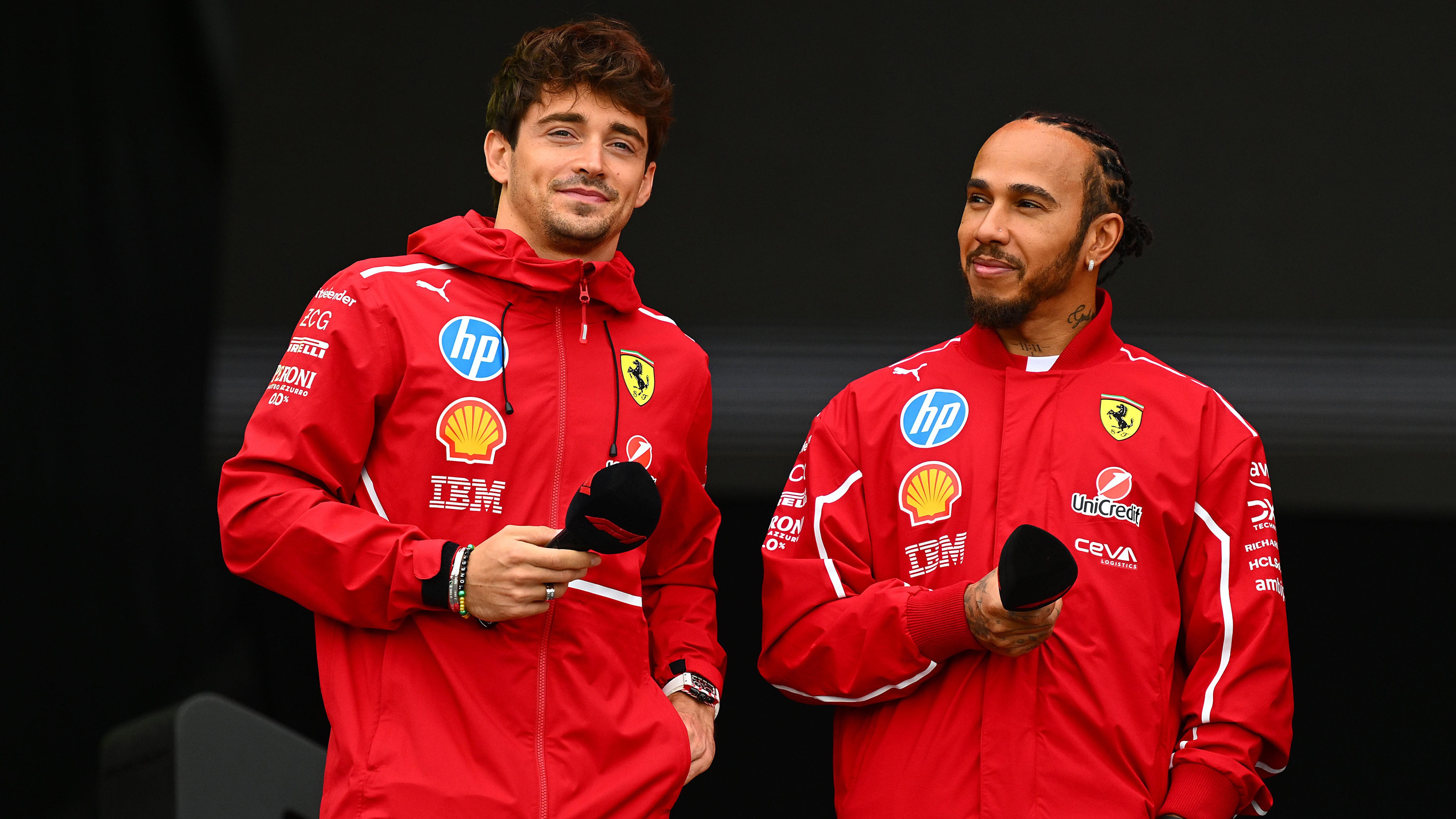 Ferrari Partner Delivers Strong Response After Harsh Charles Leclerc Criticism 2 Lewis Hamilton and Charles Leclerc in discussion during a Ferrari weekend debrief