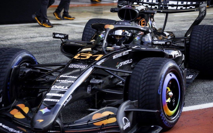 F1 Teams Face Critical Challenge Ahead of Barcelona GP 3 McLaren staff prepare the garage and equipment ahead of Barcelona running