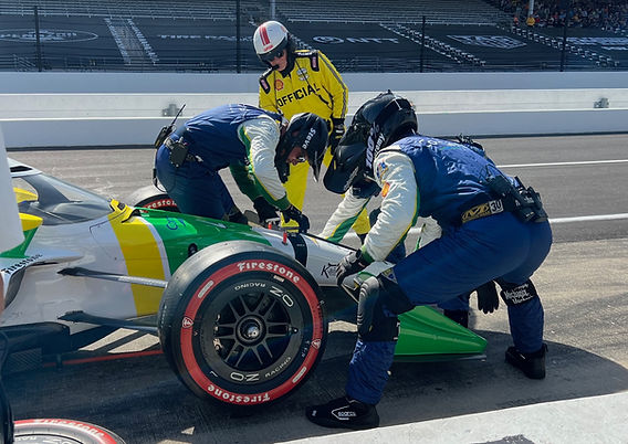 F1 Rookie’s Terrifying Pit Lane Crash Injures Mechanic 3 Race team crew working in the pit lane during a grand prix weekend