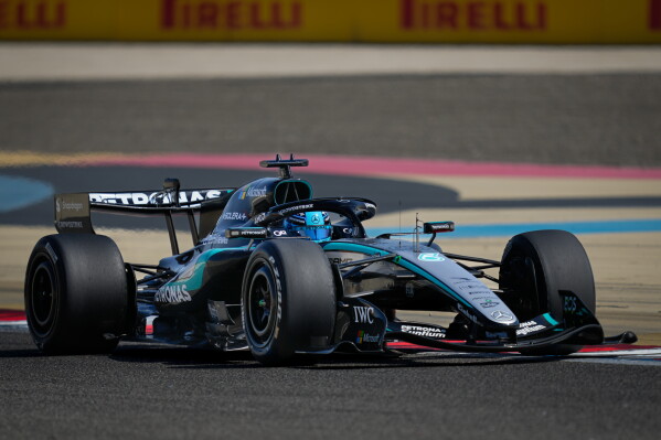Mercedes Faces New Risks as F1 Reveals Major Calendar Overhaul 3 Mercedes mechanics prepare the car amid engine rules discussions