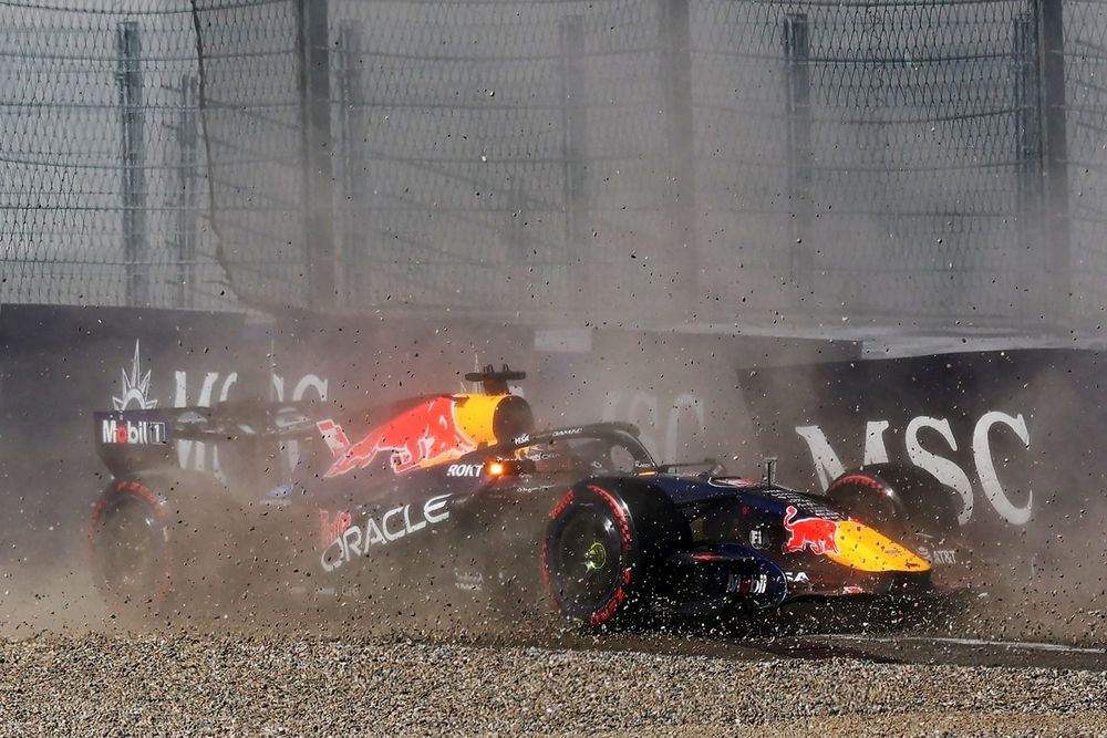 Red Bull issues crucial update on faulty upgrade after Verstappen crashes 3 Red Bull engineers working on rear wing components in the garage