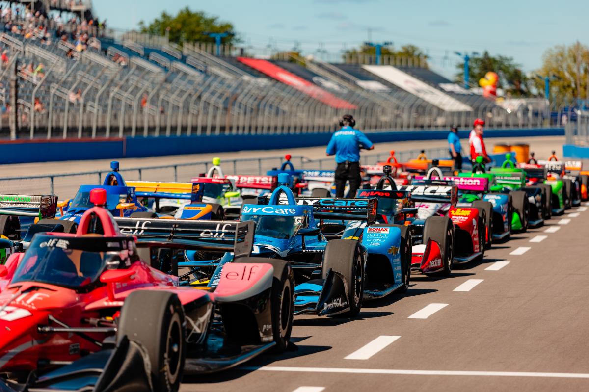 Paddock Buzz: Drivers Gear Up for Intense, Tactical Sunday at Milwaukee 3 Spectators and signage for the Snap-on IndyCar weekend at the Milwaukee Mile