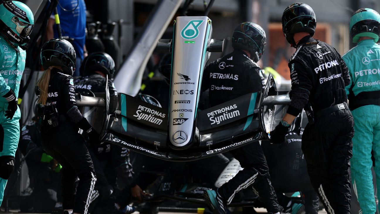 How Reliability Issues Have Cost Mercedes Valuable Points So Far 2 Mercedes mechanics work on the car amid 2026 reliability concerns