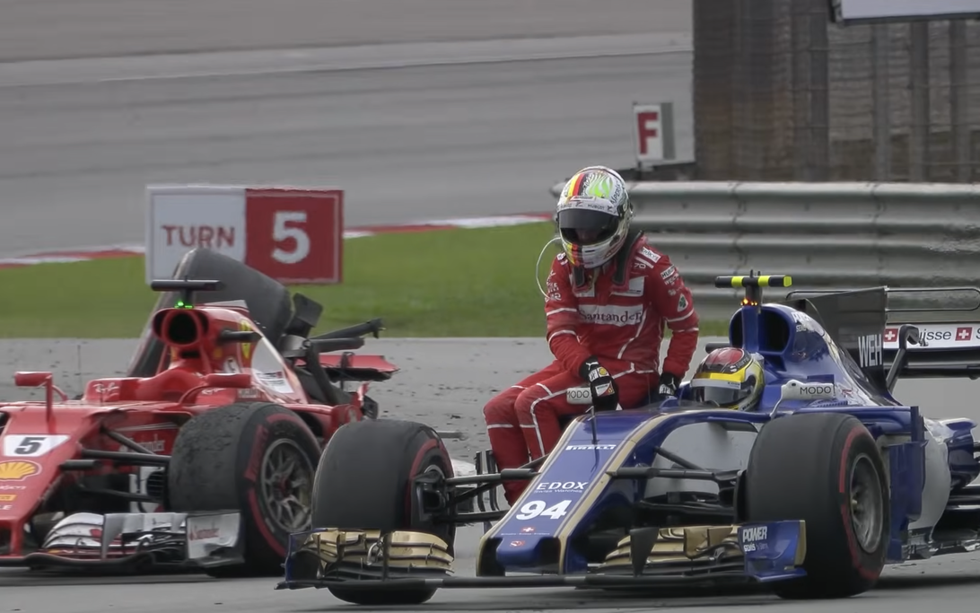 Sebastian Vettel Gets Unexpected Ride After Strange Post-Race Crash 2 Sebastian Vettel rides on Pascal Wehrlein’s Sauber after the Sepang 2017 cool-down lap collision