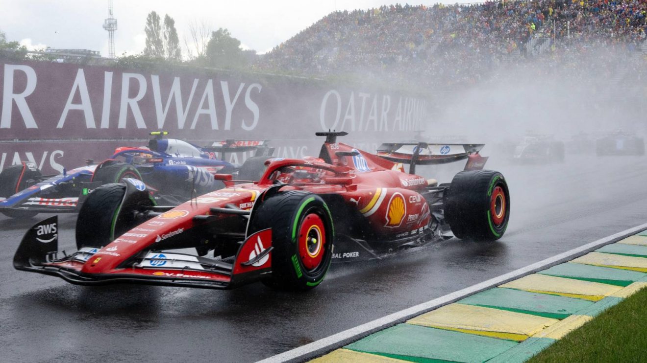 Charles Leclerc exposes strange Ferrari flaw behind Verstappen loss 3 Ferrari mechanics and Charles Leclerc prepare for qualifying runs in Singapore