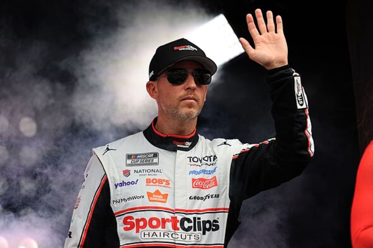 Denny Hamlin Reveals Shock After Unknowingly Giving Kyle Larson the Wave-Around 3 Denny Hamlin and the No. 11 team discuss strategy on pit road during the NASCAR Cup race.