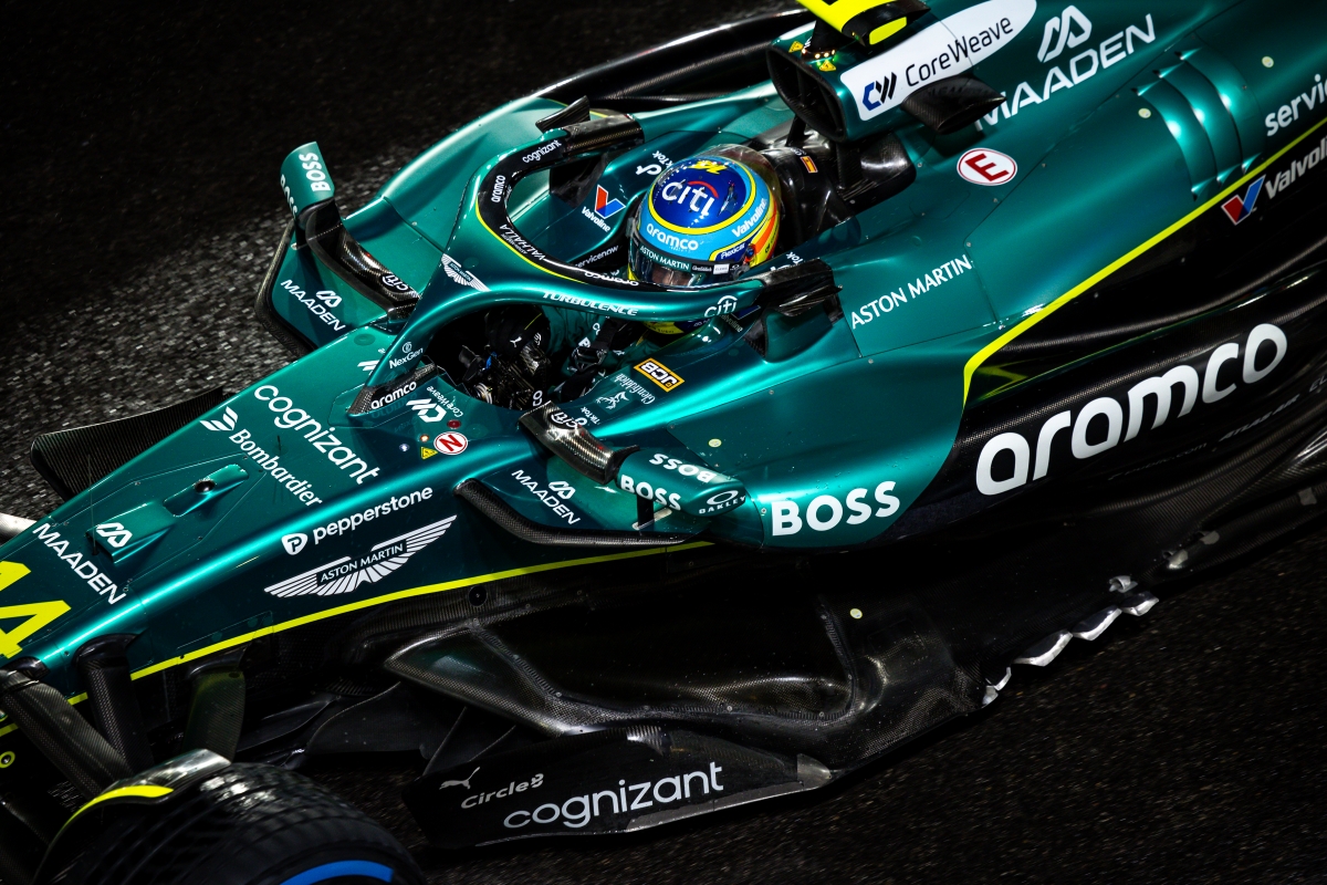 Fernando Alonso Reveals Exciting New Surprises in Big Motorsport Challenge 3 Fernando Alonso in Aston Martin attire evaluating strategic options during a Formula 1 weekend