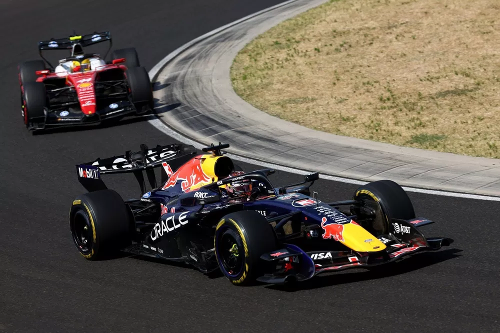 How Max Verstappen and Ferrari Seized the Unexpected Twist in Singapore 3 Ferrari and Red Bull cars emphasizing contrasting aerodynamic strategies in Singapore