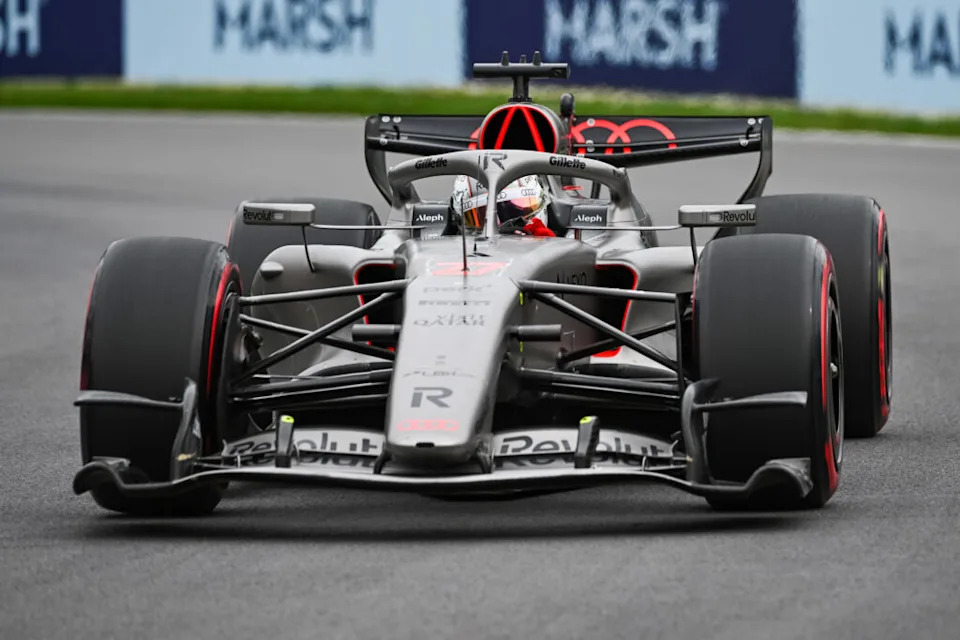 F1 Timing Glitch Protects Hulkenberg From Painful Grid Drop 3 Nico Hulkenberg speaks to his team after stewards' review
