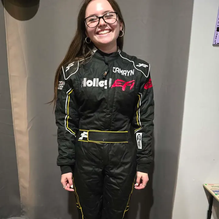 A driver in a black FervoGear suit A driver in a black FervoGear suit