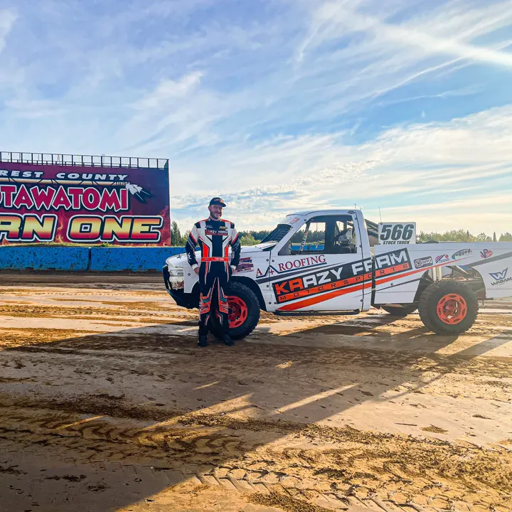A FervoGear customer with his race truck in a stadium A FervoGear customer with his race truck in a stadium