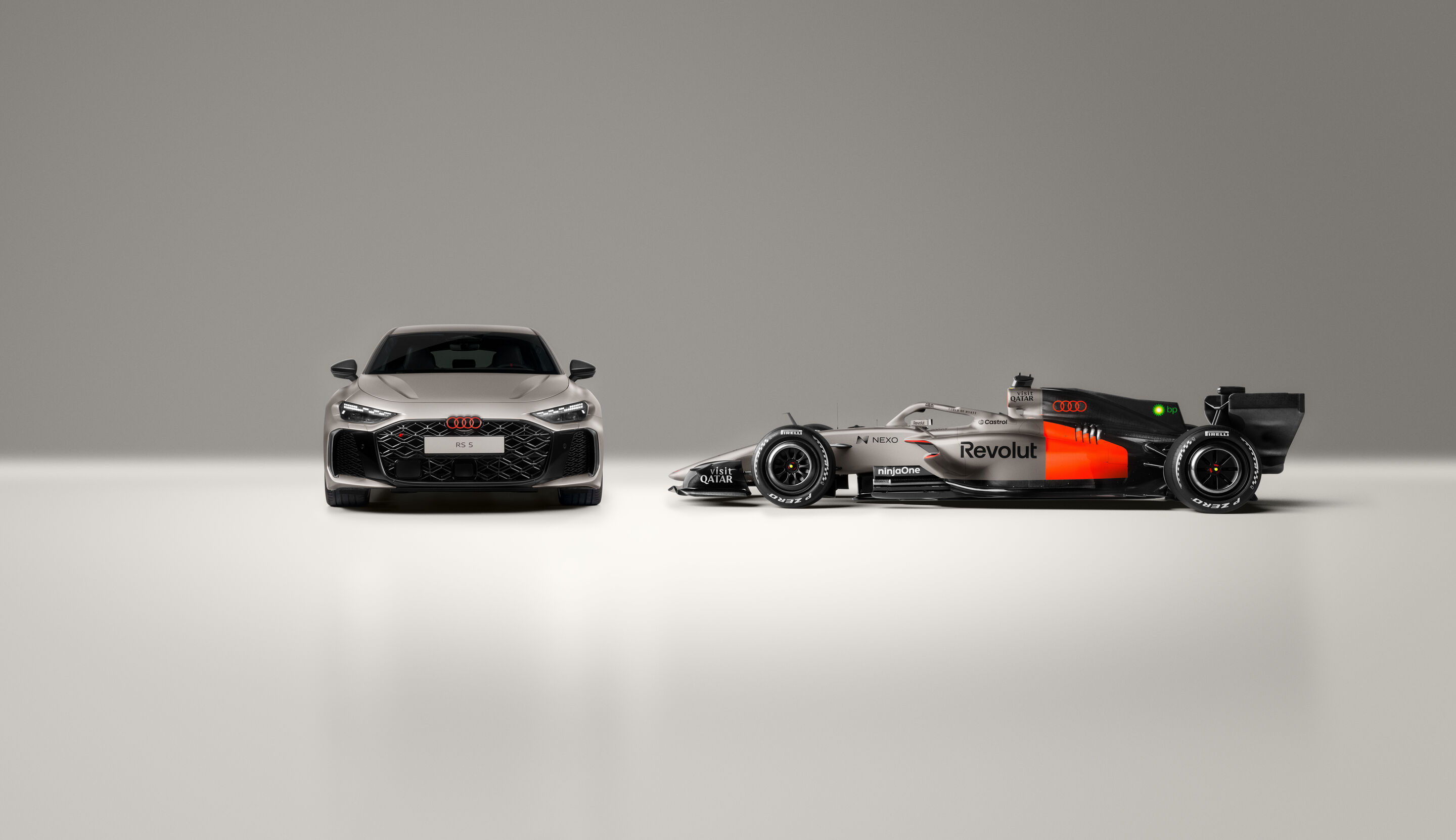 Audi Faces Crucial Test to Prove Bold F1 Championship Claim 3 Audi RS 5 hot lap car showcased at a Formula 1 event